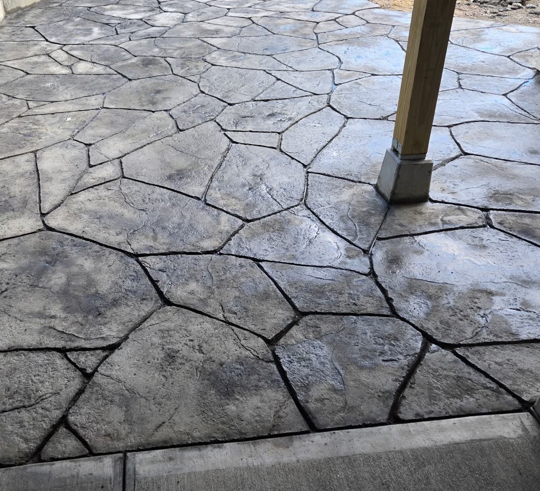 Close view of carved and stamped concrete finished in an irregular flagstone pattern